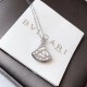 BVLGARI DIVAS' DREAM necklace in 18 kt white gold with pendant set with mother-of-pearl element and one diamond.