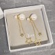 Dior La Petite Tribale CD Signature Star Detail White Pearl Women’s Yellow Gold Asymmetric Drop Earrings