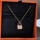 Hermes Pendant in rose gold set with diamonds and Kelly snap closure