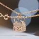 Hermes Pendant in rose gold set with diamonds and Kelly snap closure